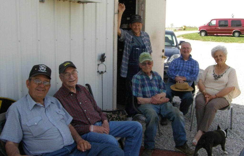 Harold K Vollrath seated with friends